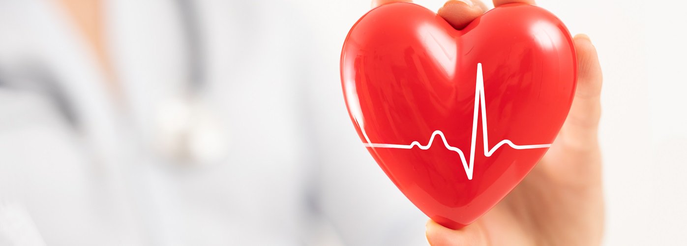 Red heart with ECG line symbolising cardiology care